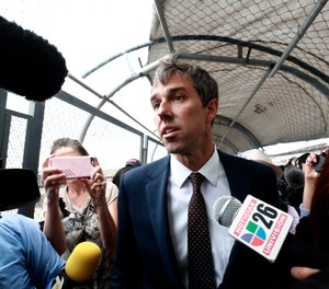 Democratic presidential candidate Beto O'Rourke is surrounded by reporters as he walks on an international bridge to cross into Ciudad Juarez, Mexico. O’Rourke crossed the border into Mexico for the funeral of one of the 22 people killed in a mass shooting at a Walmart in El Paso, Texas. (Photo/AP, Christian Chavez)