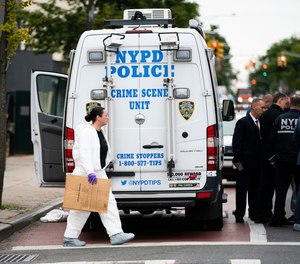 NYPD investigates the scene of a shooting in the Brooklyn borough of New York on Saturday, Oct. 12, 2019.