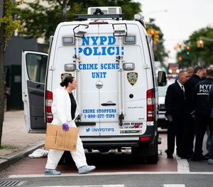 NYPD investigates the scene of a shooting in the Brooklyn borough of New York on Saturday, Oct. 12, 2019.