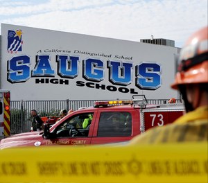 First responders standby for any injured students after a gunman opened fire at Saugus High School on Thursday, Nov. 14, 2019, in Santa Clarita, Calif.