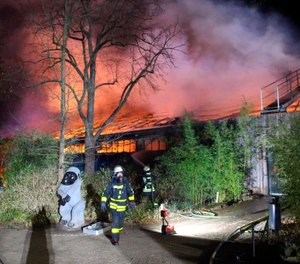 Firefighters stand in front of the burning monkey house at Krefeld Zoo, in Krefeld, Germnay, Wednesday Jan 1, 2020. A fire at a zoo in western Germany killed a large number of animals in the early hours of the new year, authorities said. (Photo/Alexander Forstreuter, dpa via AP)