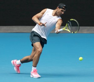 Spain's Rafael Nadal practices on Rod Laver Arena ahead of the Australian Open tennis championship in Melbourne, Australia, Thursday, Jan. 16, 2020. Nadal teamed up with Country Fire Authority Firefighter Deb Borg in a charity match for wildfire relief ahead of the championship. (Photo/Mark Baker, AP)