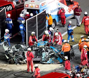 Ryan Newman is moved to an ambulance after rescue workers removed him from his car after he was involved in a crash on NASCAR Daytona 500 auto race at Daytona International Speedway, Monday, Feb. 17, 2020, in Daytona Beach, Fla.