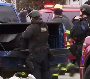 This image provided by WISN-TV, police respond to a possible shooting at the Molson Coors Brewing Co. campus in Milwaukee on Wednesday, Feb. 26, 2020. WISN-TV reported Wednesday that a Molson Coors employee received an email about an active shooter near one of the buildings.