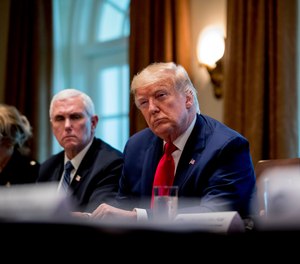 President Donald Trump and Vice President Mike Pence attend a meeting with pharmaceutical executives on the coronavirus in the Cabinet Room of the White House, Monday, March 2, 2020, in Washington.