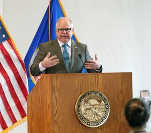 Minnesota Gov. Tim Walz addresses the media during news conference, Wednesday, March 18, 2020, in St. Paul, Minn., where he gave an update on the state's effort to slow down the coronavirus.