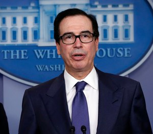 Treasury Secretary Steven Mnuchin speaks about COVID-19 on March 25, 2020, in Washington. Mnuchin said hazard pay for first responders and healthcare workers could be included in future stimulus legislation.