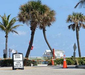 This photo shows a view of Lantana Municipal Beach in Palm Beach, Fla., which is closed due to the COVID-19 pandemic. A Florida couple has claimed that West Palm Beach paramedics mistreated them during a medical call when they shouted questions from 10 feet away and asked the patient to drive himself to the hospital. Fire Chief Diana Matty said paramedics are distancing as a precaution to protect themselves and preserve PPE but that the protocol is a work in progress. (Photo/mpi04, MediaPunch, IPX)