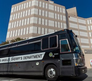 A Los Angeles County Sheriff's Department prisoner transportation bus leaves the Twin Towers Correctional Facility in Los Angeles on Wednesday, April 1, 2020. California plans to release inmates due to be paroled to free space in prisons in anticipation of a coronavirus outbreak.