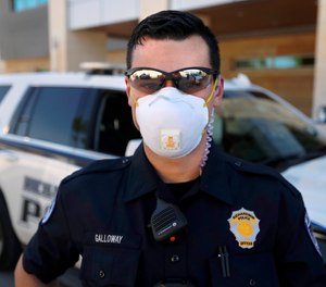 Richardson police officer Austin Galloway is pictured at the start of his shift, Wednesday, April 8, 2020. Mask and gloves are part of their daily routine amid concerns of the COVID-19 crisis.