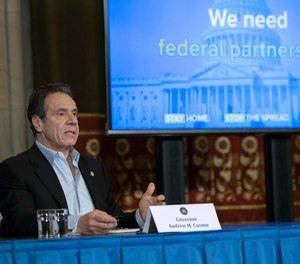 In this April 18, 2020 photo provided by the Office of Governor Andrew M. Cuomo, Gov. Cuomo provides a coronavirus update during a press conference in the Red Room at the State Capitol in Albany. Cuomo has called for the federal government to implement 50% hazard pay for frontline workers, including first responders and healthcare personnel.