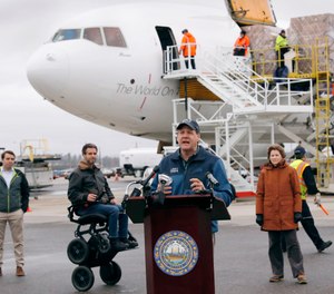 New Hampshire Governor Chris Sununu addresses the media as PPE is unloaded from a cargo plane on April 30. Sununu announced on Monday, May 4 that New Hampshire first responders will be eligible for up to $300 weekly through CARES Act funds received by the state.