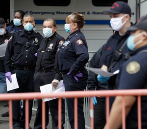 First responders wait in line to be tested for coronavirus antibodies at a testing site in Jersey City, N.J., Monday, May 4, 2020. Villanova University's M. Louise Fitzpatrick College of Nursing in Pennsylvania has launched the CHAMPS Caring about Health for All study to assess the short- and long-term impacts of the pandemic on first responders' and healthcare workers' physical and mental health. (AP Photo/Seth Wenig)