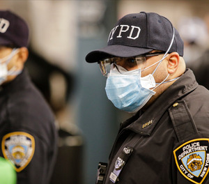 New York Police officers clear trains at the Coney Island Stillwell Avenue Terminal, Tuesday, May 5, 2020, in the Brooklyn borough of New York.