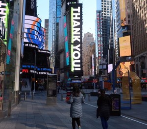 An electronic billboard in Times Square gives a thank you to essential workers on Tuesday, May 5, 2020 in New York.