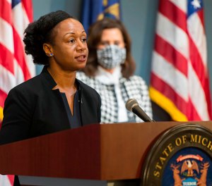 Michigan's Chief Medical Executive Dr. Joneigh Khaldun (left) urged residents not to delay medical treatment after the state saw a 62% increase in out-of-hospital deaths during the pandemic. (AP Photo/Michigan Executive Office of the Governor via AP)