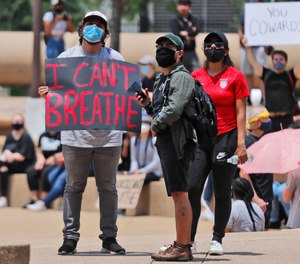 Protesters gather in front of Dallas City Hall, Tuesday, June 2, 2020. EMS providers across the country are grappling with the uncharted territory of facing a pandemic and civil unrest at the same time.