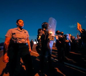 Who is taking care of the cops when they are enduring hatred, betrayal and intense scrutiny? (AP Photo/Gerald Herbert)