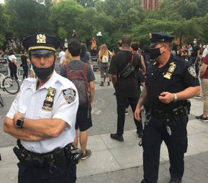 NYPD Police Officers monitor crowds at a July 7 Black Lives Matter prostes.