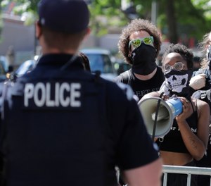 Some police agencies are getting a real-life report card on how well they have developed relationships across their community. (AP Photo/Ted S. Warren)