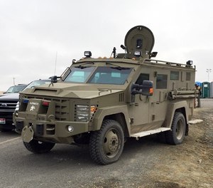 Armored vehicle known as a Bearcat blocks the road to the Malheur Wildlife Refuge at an FBI checkpoint outside of Burns, Ore., Friday, Feb. 12, 2016.
