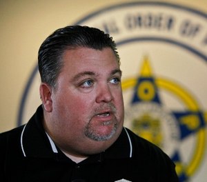 Fraternal Order of Police Lodge 5 president John McNesby responds to questions from the news media Monday, Oct. 1, 2012, at F.O.P. headquarters in Philadelphia.