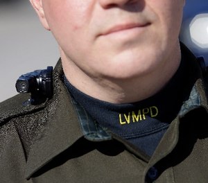 Las Vegas police Sgt. Peter Ferranti models a body camera Wednesday, Nov. 12, 2014, in Las Vegas.