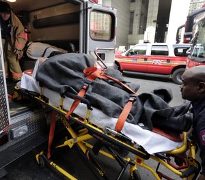 In this Jan. 9, 2013 file photo, an injured ferry passenger is loaded into an ambulance in New York.