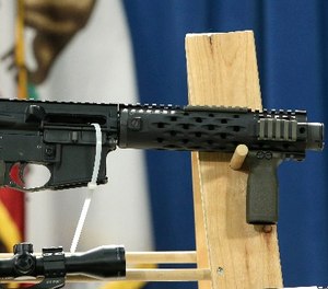 A homemade fully automatic rifle, confiscated by the Department of Justice, is displayed at a news conference held by Sen. Kevin de Leon where he unveiled legislation dealing with so called