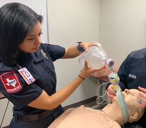 Paramedic Bianca Hines works on best airway management practices on a manikin.