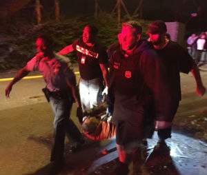 A passenger is carried following an Amtrak train crash Tuesday, May 12, 2015, near Philadelphia. Train 188 was traveling from Washington to New York City. (AP Photo/Paul Cheung)