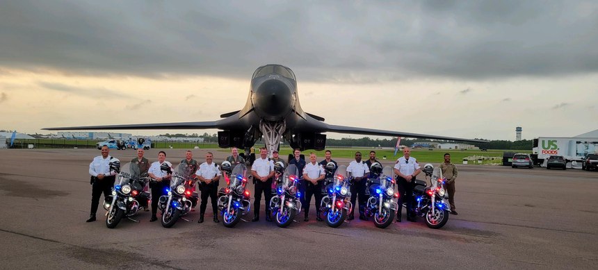 Pictured from left to right (in white) are Officers Edguardo Cruz, Melanie Sullivan and Rodney Wilkerson, with Sgt. Doug Mills, Sgt. Robert Bernhardt, and Officers Deangelo Anthony and Wayne Marrone along with the pilots and crew of a U.S. Air Force B1 bomber in Lakeland, Florida.