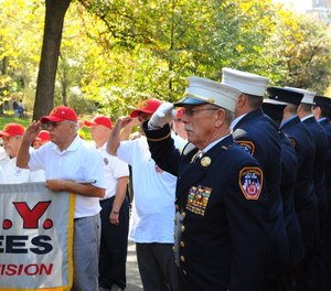 Jack Pritchard pays tribute to fallen FDNY firefighters during the 2014 FDNY Memorial Day ceremony.