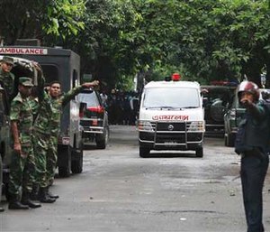 An ambulance transports bodies found at a restaurant popular with foreigners after heavily armed militants attacked it on Friday night in Dhaka, Bangladesh.