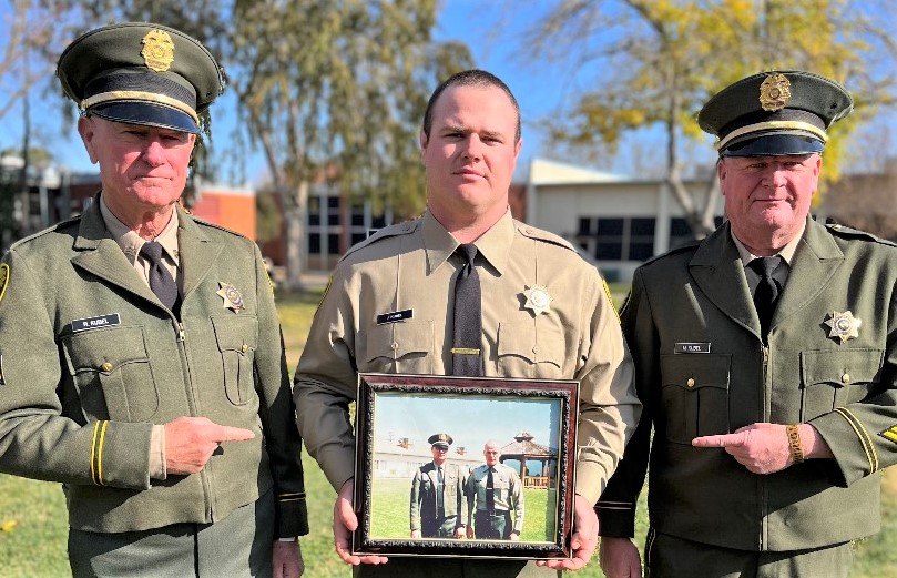 CO Joshua Kubel, center, was born the same year his grandfather retired from CDCR.