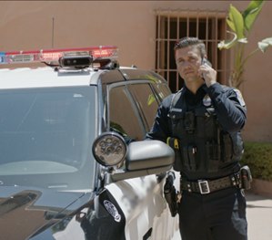 The officer's voice is often the key to de-escalation during tense altercations.