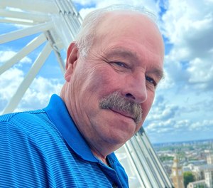 In his obituary, Bruce Lang was praised for his 30 years of service as an EMT who “died doing what he did best, taking care of everyone else.”