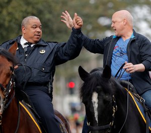 New Orleans Mayor Mitch Landrieu, right, and chief of police Michael Harrison ride on horseback at the start of the Krewe of Zulu parade on Mardi Gras day in New Orleans. A day after her first choice withdrew his candidacy, Baltimore’s mayor on Tuesday, Jan. 8, 2019, picked New Orleans Police Superintendent Michael Harrison as her nominee to lead the city’s troubled force. (AP Photo/Gerald Herbert, File)