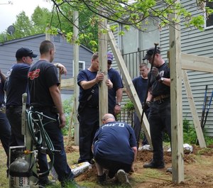 Crews build an access ramp for a citizen.