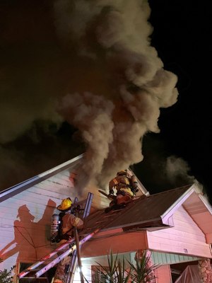 The fire spread from the half-story window above the front porch, but firefighters were able to knock that down.