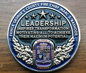 The saying Chief Bashoor chose to be engraved on his personal challenge coin says – 