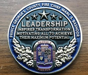 The saying Chief Bashoor chose to be engraved on his personal challenge coin says –