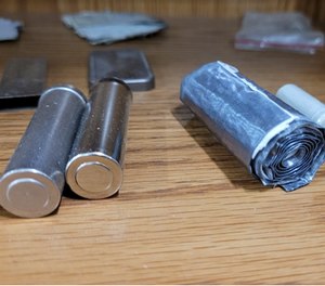 On the right you can see layers of film found inside a cylindrical battery cell.