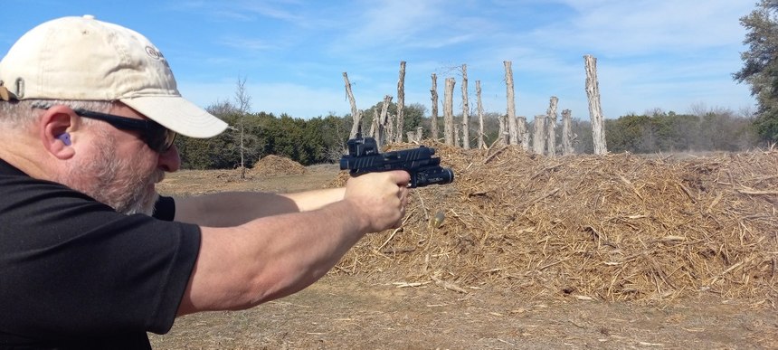 If you look closely, there’s an empty case in the air about shoulder high and a second empty case is being ejected. The Beretta APX A1 can be shot very quickly and accurately.