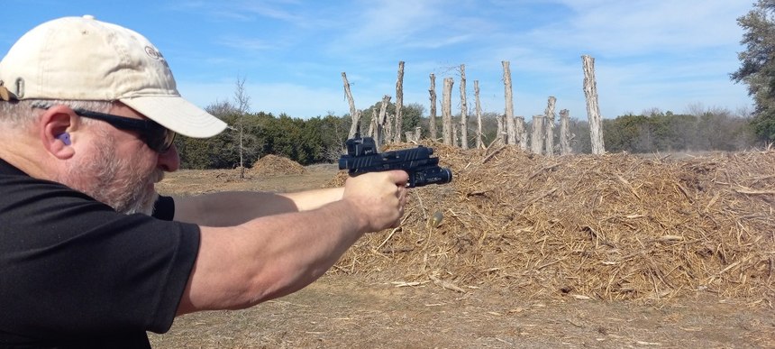 If you look closely, there’s an empty case in the air about shoulder high and a second empty case is being ejected. The Beretta APX A1 can be shot very quickly and accurately.