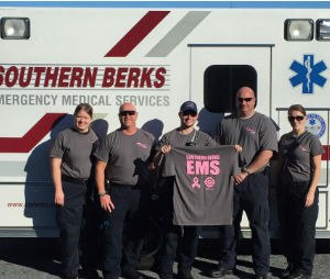 Personnel from Southern Berks Regional EMS display the October duty T-shirt, which is also for sale