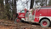 Photos: 2 Ark. firefighters injured after fire truck hits tree