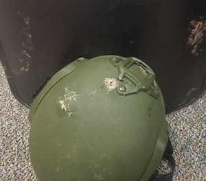 A bullet hole in a helmet a Boone Police officer was wearing when shot during a standoff in Boone, N.C. That officer survived, but two deputies were killed in that tragic incident.