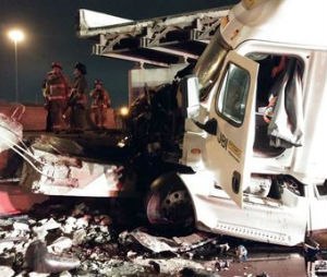 This photo provided by the Cincinnati Fire and EMS, shows the scene following a highway overpass collapse in Cincinnati, Monday, Jan. 19, 2015. The Cincinnati Enquirer reports that according to a police dispatch the southbound Interstate 75 was closed indefinitely after the collapse of an overpass. (AP Photo/Cincinnati Fire and EMS)
