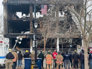 Buffalo Fire Department members honored fallen Firefighter Jason Arno by hanging a flag on top of the 745 Main Street building in March.